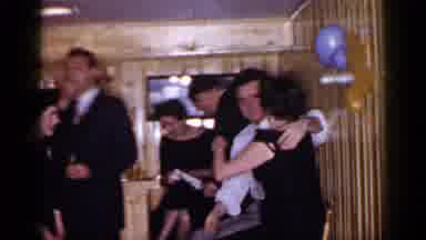 Mineola New York (1966): Two People At A Part Kissing One Another