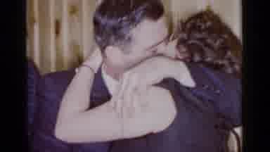 Mineola New York (1966): Middle Aged Man And Woman Kiss At Bar With Mustache Man