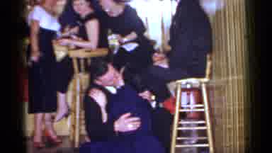 Mineola New York (1966): Man In A Suit Kissing A Woman In A Blue Dress While They