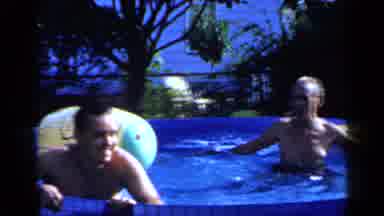 Mineola New York (1966): Men In Bathing Suits Enjoy Water Then Grab And Push