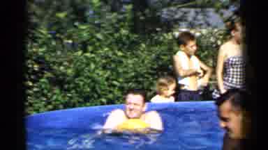 Mineola New York (1966): Group Of People Swimming In A Pool And Splashing Water