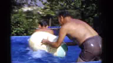 Mineola New York (1966): Group Of People Playing With Each Other In A Pool With