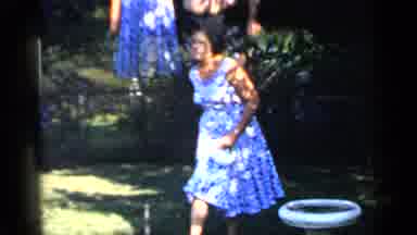 Mineola New York (1966): A Woman Wearing A Summer Dress Tossing A Frisbee Or Ball