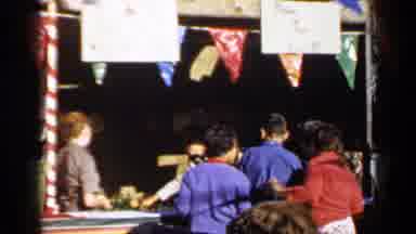 Mineola New York (1966): People Are Seen Playing Games At A Fair On A Sunny Windy