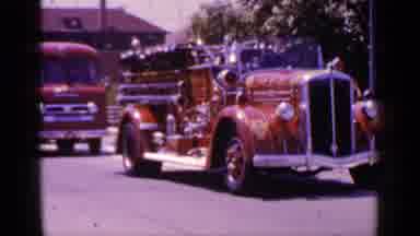 Mineola New York (1966): A Couple Of Vintage Vehicles Moving Forward On The Street