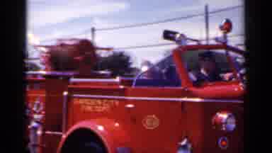 Mineola New York (1966): Marching Band Marching Through The Streets At The Parade