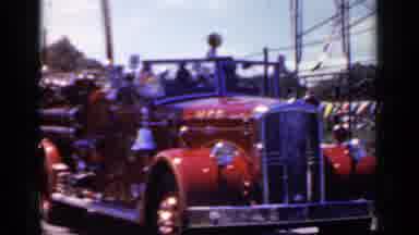 Mineola New York (1966): A Beautiful Red Colored Vehicle Is Moving Slowly Through
