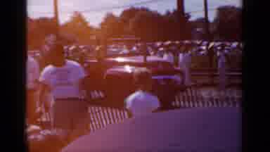 Mineola New York (1966): Car Driving Past People As They Watch Then Person Holding