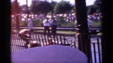 Mineola New York (1966): A Pickup Truck Without Doors Pulls Forward While A Person