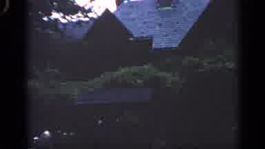 Massachusetts USA (1968): People Walking By A House With Well And A Building