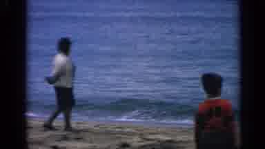 Massachusetts USA (1968): People Standing Around The Beach Looking At The Waves