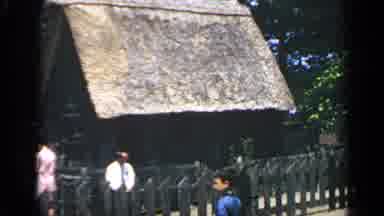 Massachusetts USA (1969): People Surround Thatch Hut