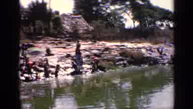 India (1970): Beautiful River With People On Shore Cleaning Their Cloths
