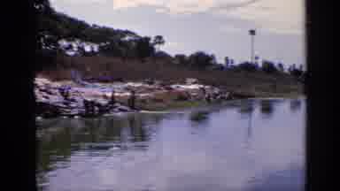 India (1970): Beautiful Shot Of A Lake And Grass With Trees In The Distance