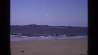 India (1970): Young Man Seen Frock-Ling At A Beach In The Water