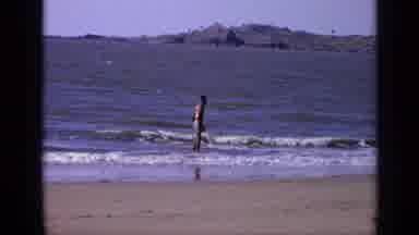 India (1970): Person Standing In Water Looking Around Then Cow Walking In The