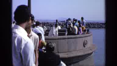 India (1970): Harbor With Many People On It Standing And Walking Around Near Water