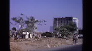 India (1970): Poor Village Behind A Tropical Highrise