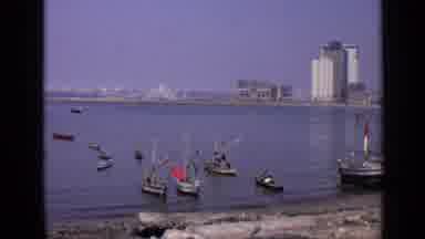 India (1970): An Ocean Beach With Several Small Boats Near The Shore