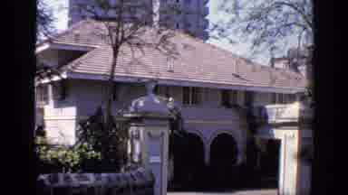 India (1970): People Working On White Building On A Sunny Day