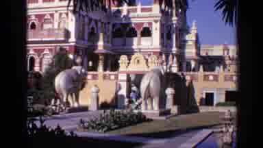 India (1970): Family Walking Around Museum Elephants Sunny Tourist Attraction