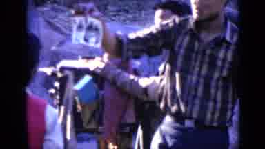 India (1970): Man Wearing Blue Pants Prepares To Take Picture Of Stone Towering