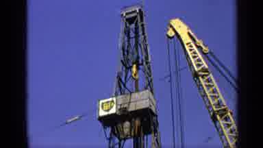 United Kingdom (1970): A Metal Tower Yellow Crane And Black Helicopter