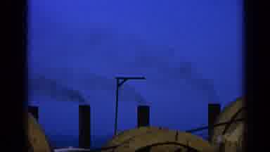 United Kingdom (1970): A Factory Or Steam Boat With Its Pipes Smoking With Black