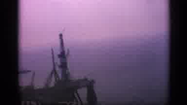 United Kingdom (1970): Oil Platform On Ocean With A Ship On Background