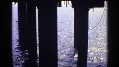 United Kingdom (1970): Water Reflections Under Pier In The Ocean's Restless Waves