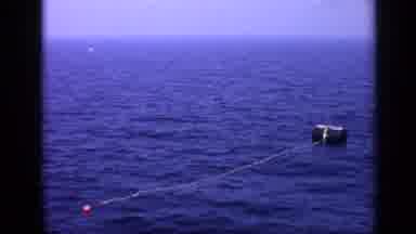 United Kingdom (1970): Box In The Middle Of The Ocean And Guys On A Boat