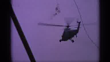 United Kingdom (1970): Helicopter Slowly Flying Forward A Head Of A City Sky
