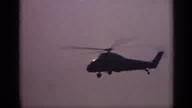 United Kingdom (1970): Large Helicopter With Propellers Whirring Over The Water
