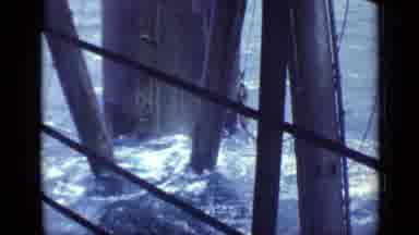 United Kingdom (1970): A Wavy View Underneath Of A Pier Support Column With Waves
