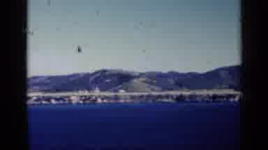 CUBA-1962: Coastal View With Boats, Helicopter Flying Over Water And Hills