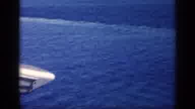 CUBA-1962: Sight Of Land Beyond The Water Then Men Sit Quietly In The Sunshine
