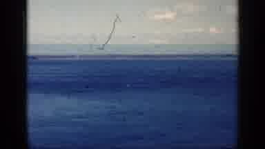 Cuba (1962): Low Flying Airplane Soaring Low Across A Vast Blue Body Of Water