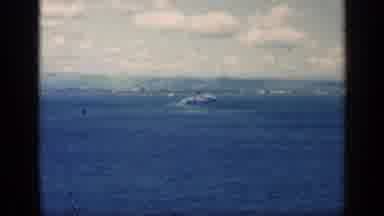 CUBA-1962: Boat Moving Across Blue Water Under Cloudy Sky