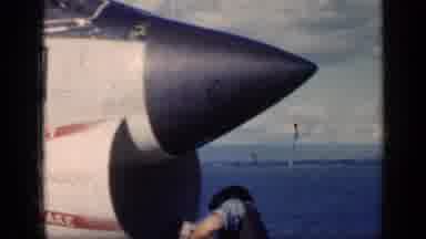 Cuba (1962): Pilot Sitting In A Military Plane That Is On The Deck Of A Massive