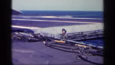 Cuba (1962): Sailors Work On The Deck Of A Vast Battleship Sailing In The Open