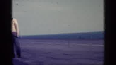 CUBA-1962: Man Walks Across Airfield Near Ocean
