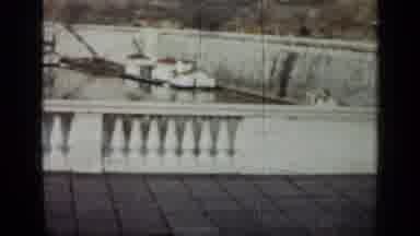 Cuba (1962): A White Bridge With A Lot Of Boats Underneath It With People Walking