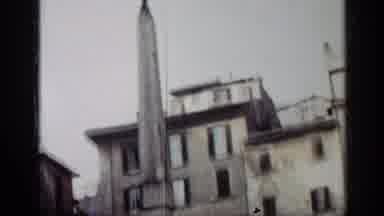 Cuba (1962): Low Angle Tall Concrete Monument Then Two Men Stand Outside A Tall