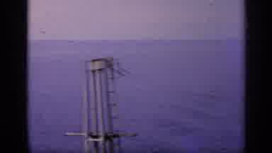 Italy-1962: A Shot Of The Ocean Moving Over To Planes On An Aircraft Carrier