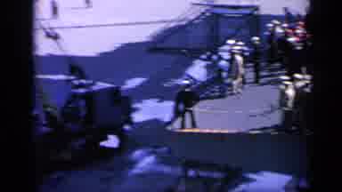 Italy (1962): Sailors Marching Onto Ship In Single File In A Sunny Day