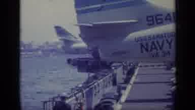 Italy (1962): Sailor Walks Toward Airplane Then Is Seen Bent Over And Lifting