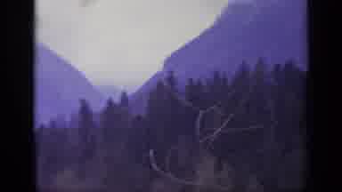 Italy (1962): Green Trees And Mist Covered Mountains On A Cloudy Day