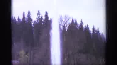 Italy (1962): Water Spouting Up From A Pool With People Beside It And Trees On The