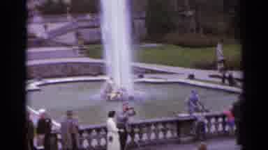 Italy (1962): Tall Spewing Fountain And Building On A Clear Day