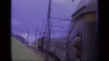 Italy (1962): Passing Snow Covered Mountains And People Looking Out Of Train Car